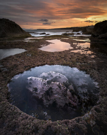 Rock pool reflecting a dramatic sunset at Bondi Beach, Sydney, Australia, fine art coastal photography.