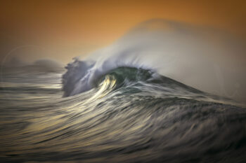Ocean wave curling in golden sunrise light at Bronte Beach, Sydney, Australia, captured as fine art seascape photography