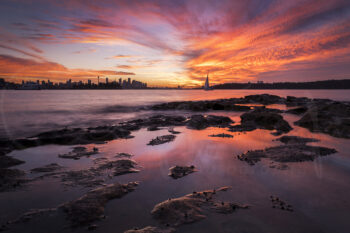 Sydney Harbour sunset from Milk Beach with Harbour Bridge, city skyline and sailboat, fine art landscape photography.
