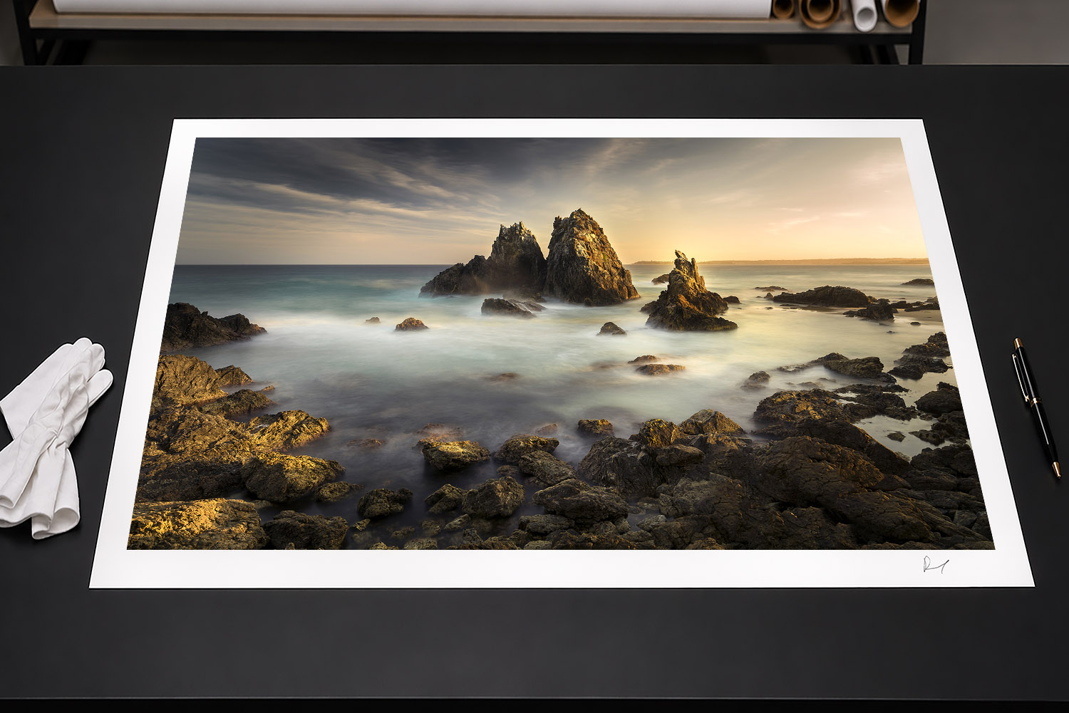 Fine art print of Camel Rock near Bermagui, NSW, glowing in golden sunset light above the ocean.