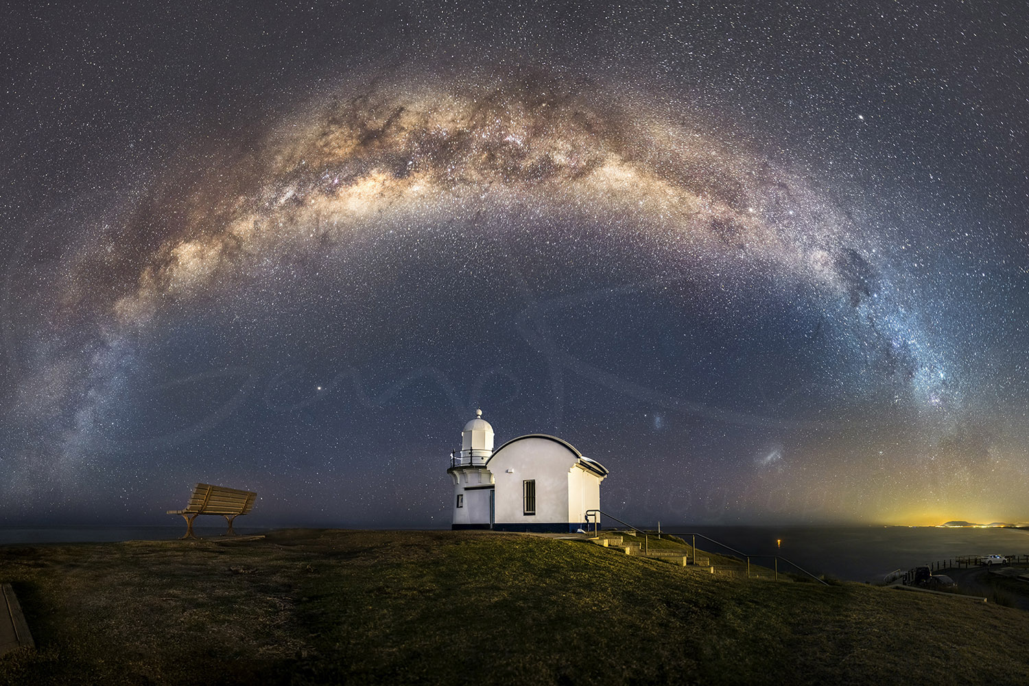 Milky Way arch over Tacking Point Lighthouse at night in Port Macquarie, NSW, Australia, fine art astrophotography.