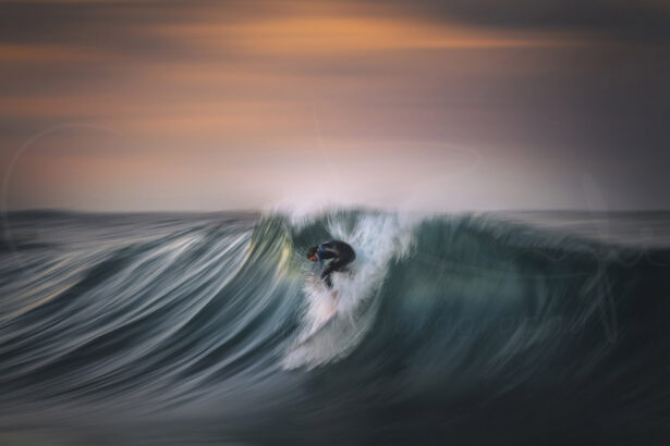 Surfer carving across a breaking wave at sunset at Bronte Beach, Sydney, captured in fine art surf photography.