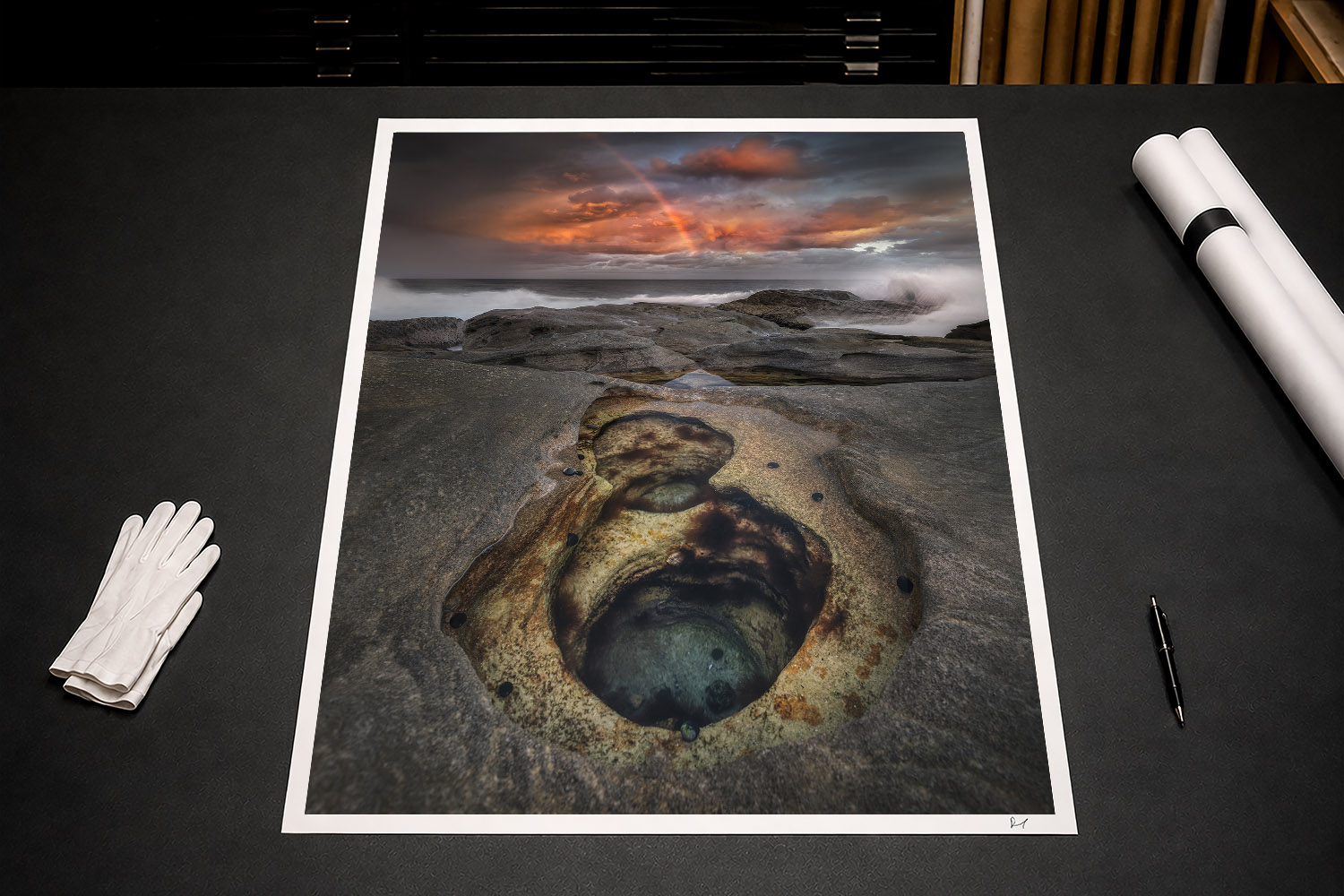 Fine art print of Bondi rock pools, crashing waves and a rainbow beneath dramatic sunset clouds in Sydney, Australia.