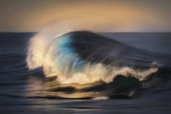 Ocean wave glowing in sunset light on the South Coast of New South Wales, Australia, in fine art seascape photography