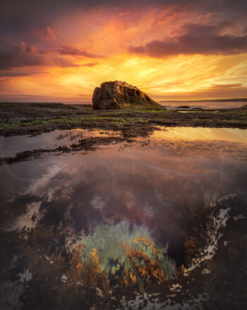 Fiery sunset reflected in a coastal rock pool at Bondi, Sydney, Australia, captured as fine art seascape photography.