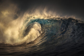 Powerful breaking ocean wave illuminated by sunset light in New South Wales, Australia, dramatic fine art ocean photography.