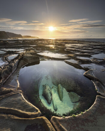 Figure Eight Pools at sunrise with clear turquoise rock pool and golden coastal light, Royal National Park fine art photography.