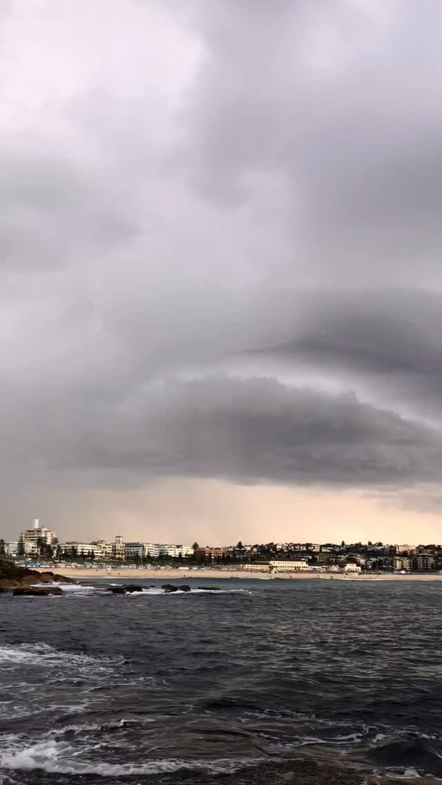 Storm clouds and sunset light at Bondi Beach 🌩️