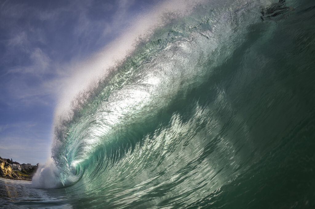 Angels of Tamarama – wild dolphins and powerful waves captured off Sydney’s coast, reflecting a rare moment of connection between humans and wildlife.