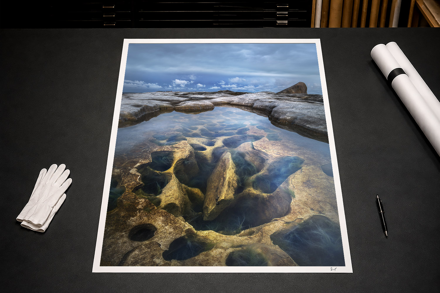 Fine art print of a Sydney rock pool with sculpted sandstone formations and clear water, Australia.