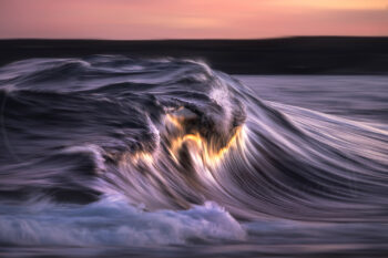 Abstract ocean wave glowing with warm sunset light in Sydney, Australia, captured as fine art seascape photography.