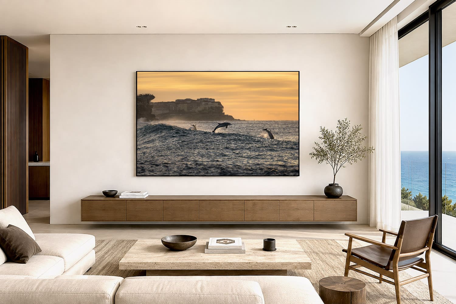 Bottlenose dolphins at Tamarama Beach, Sydney, displayed as coastal ocean wall art in a modern interior