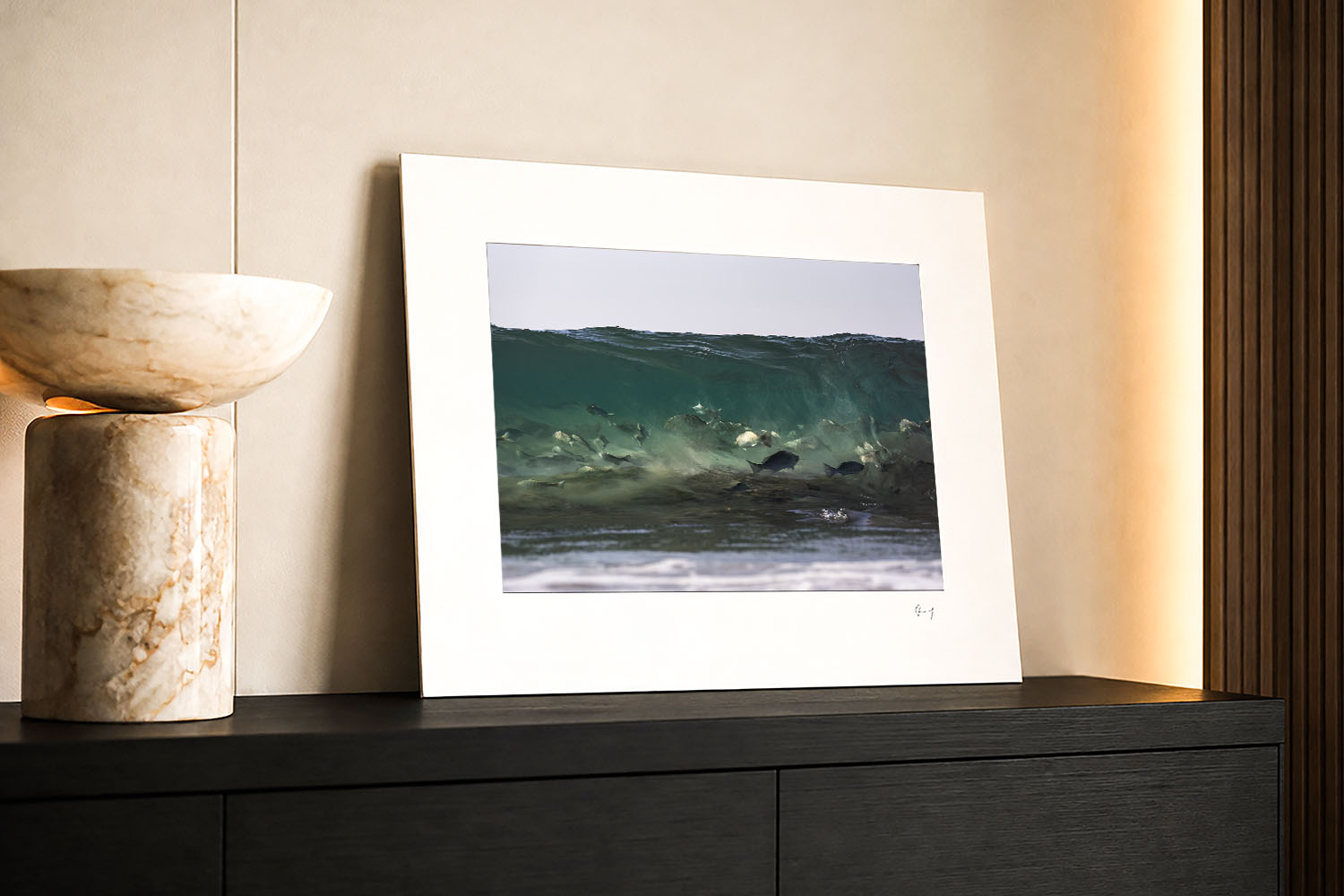 Mounted fine art print of luderick swimming beneath a translucent Byron Bay wave, displayed as wall art in a modern interior.