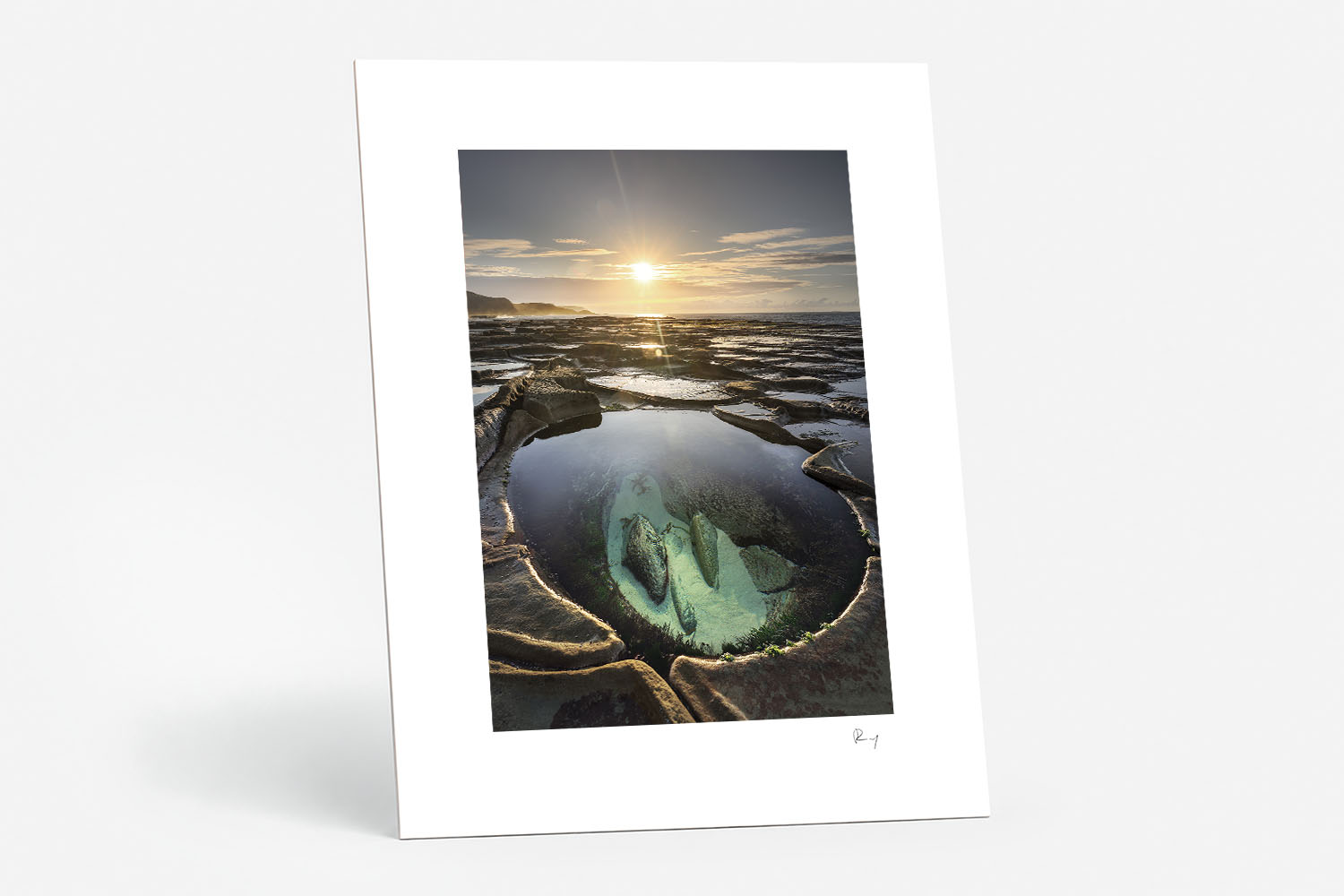 Mounted fine art print of Figure Eight Pools at sunrise, featuring a clear rock pool, rugged coastline and golden morning light.