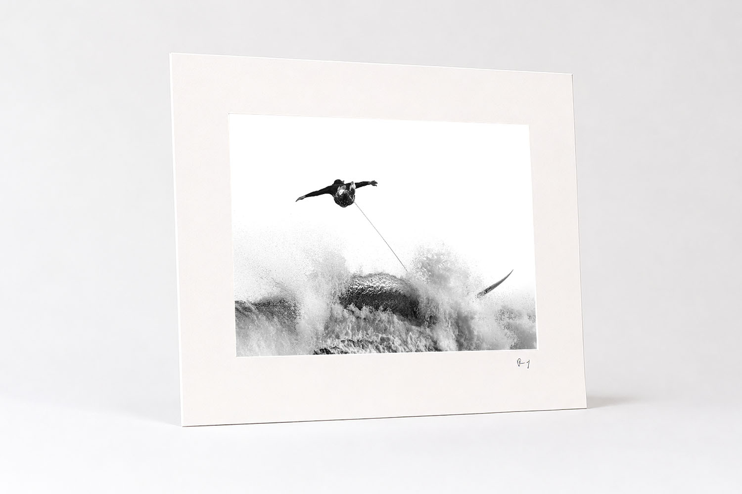 Mounted fine art print of a surfer wiping out above a powerful breaking wave at Tamarama Beach, Sydney, in black and white.