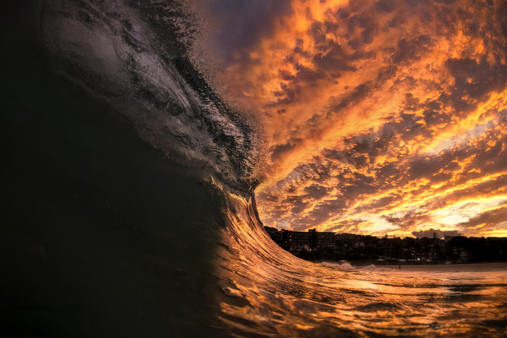 Gold Fever – Fiery sunset surf session at Bronte Beach in Sydney, featuring glowing waves and golden storm light