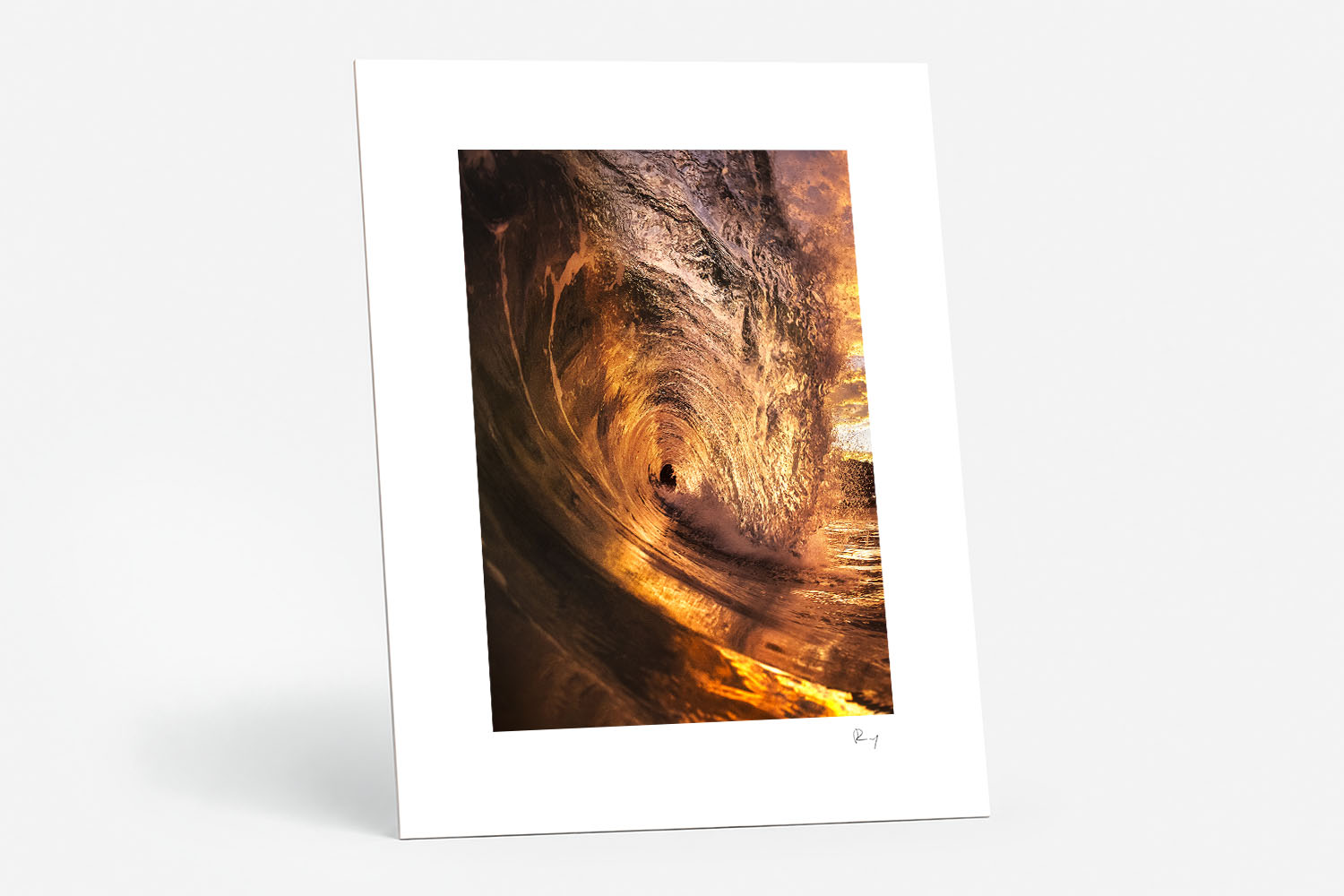 Mounted fine art print of a curling wave glowing with rich golden sunrise light at Bronte Beach, Sydney.