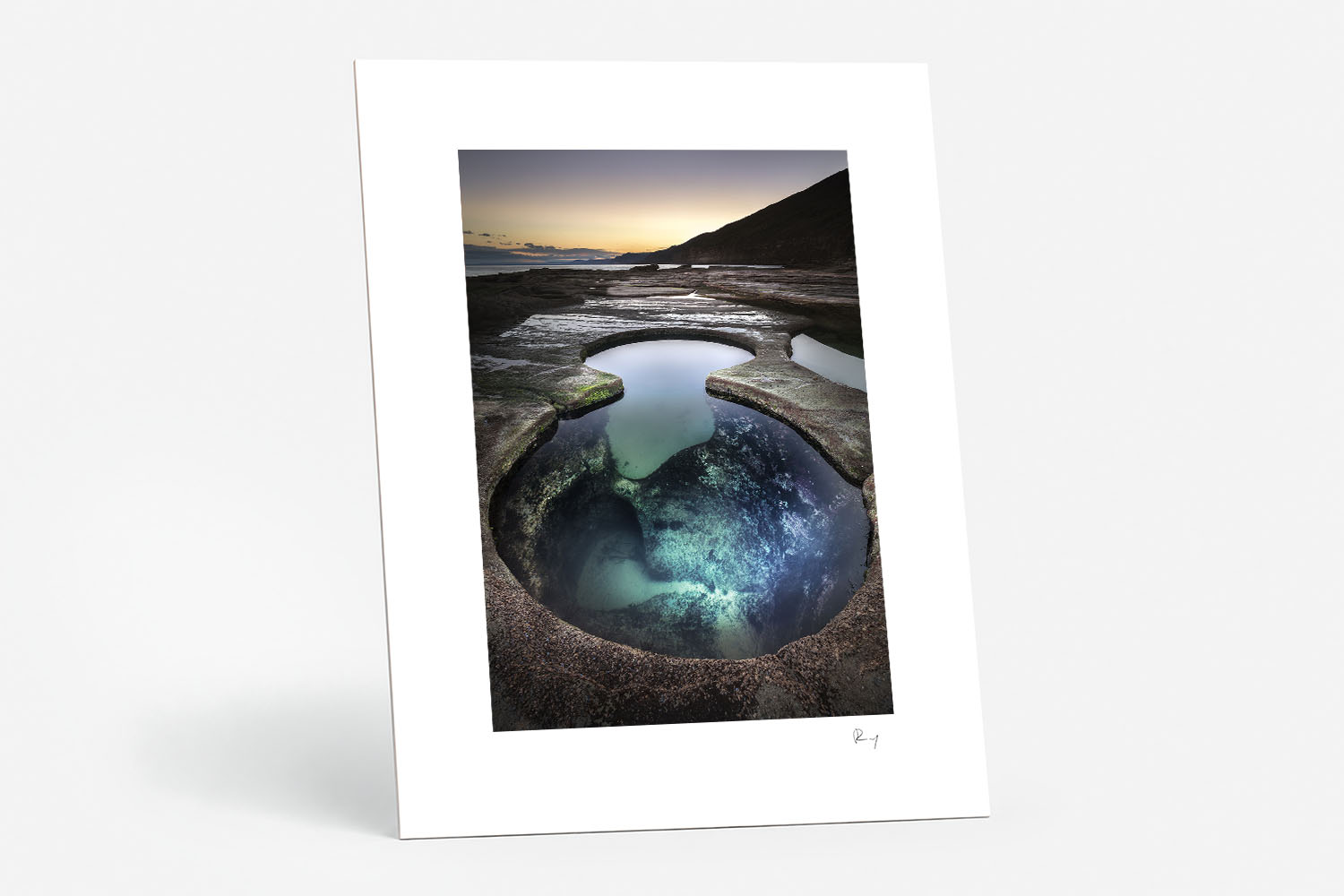 Mounted fine art print of Figure Eight Pools at sunset, featuring clear turquoise rock pools and the rugged NSW coastline.
