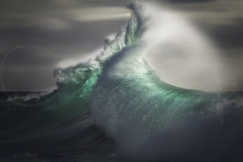 Emerald wave exploding into sweeping offshore spray at sunrise in Byron Bay, limited edition fine art ocean photography print.