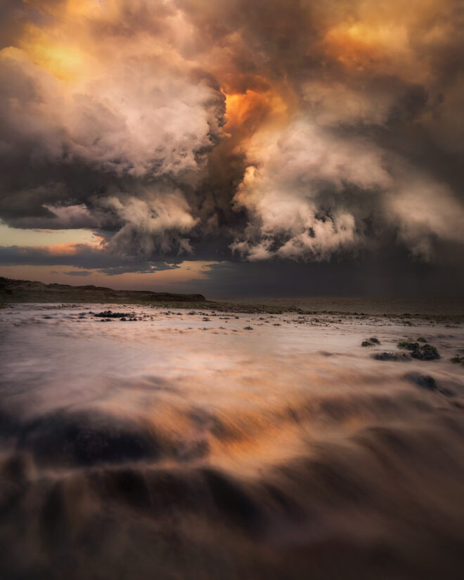 Award-winning fine art ocean print of fiery storm clouds above Tamarama Beach, Sydney – "Storming of the Tartarus"