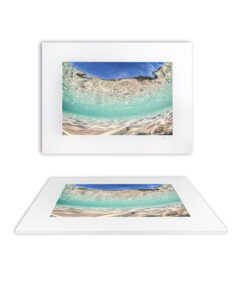 Mounted fine art print of shimmering turquoise shallows at Jervis Bay, Australia, where sunlight dances across rippled sand and water.