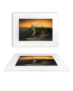 Powerful green sunrise wave curling under warm sky on the South Coast of New South Wales.