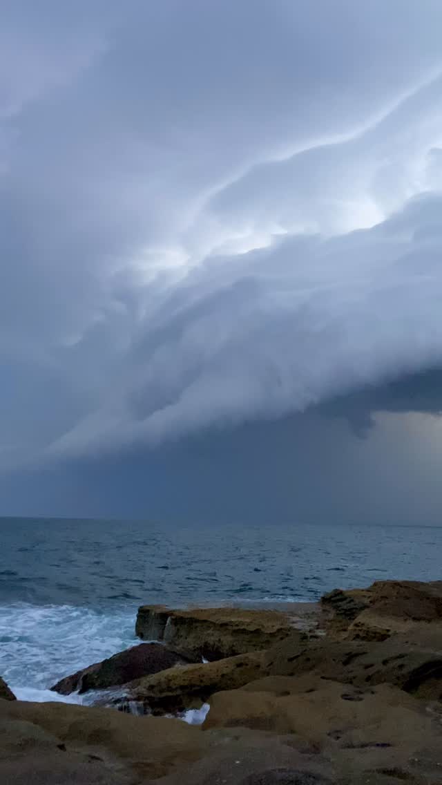 Dark clouds gathering above the coast.
