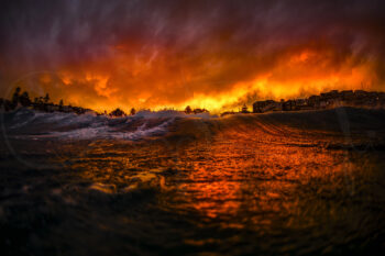 Ocean waves glowing beneath a fiery sunset sky at Bronte Beach, Sydney, fine art ocean photography