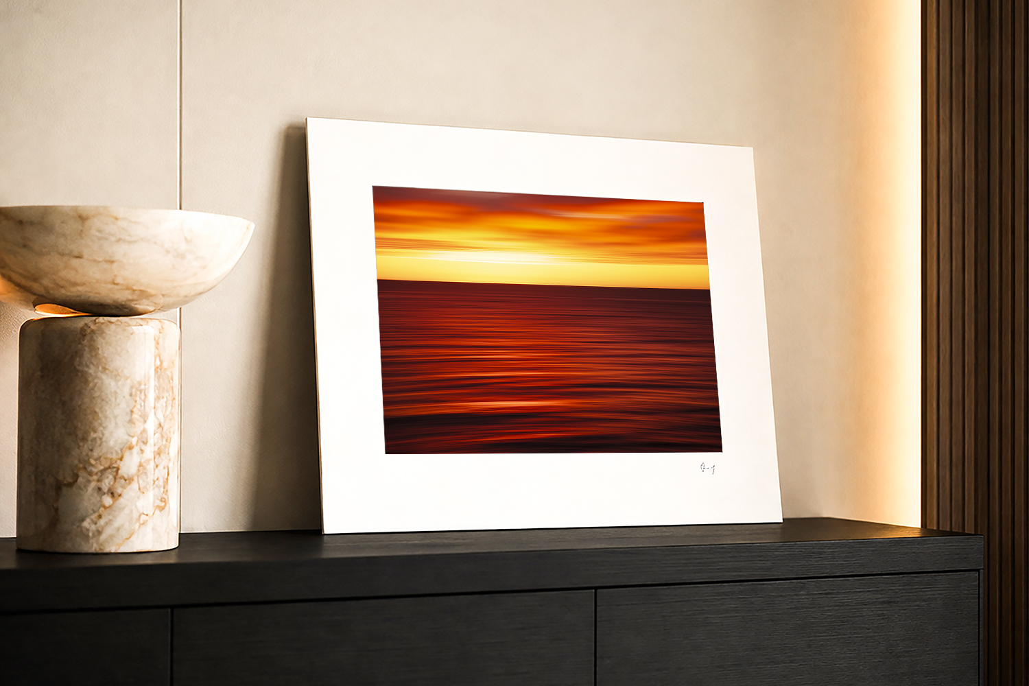 Abstract Bondi Beach sunrise fine art print displayed in a modern interior, with vivid red, orange and golden tones.