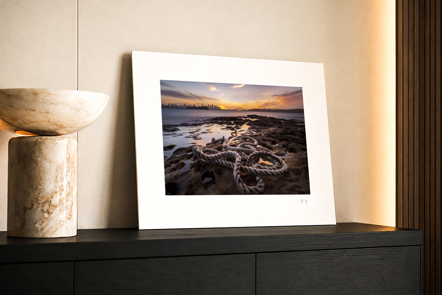 Mounted Sydney Harbour sunset fine art print displayed on a cabinet, featuring the view from Milk Beach in Sydney.