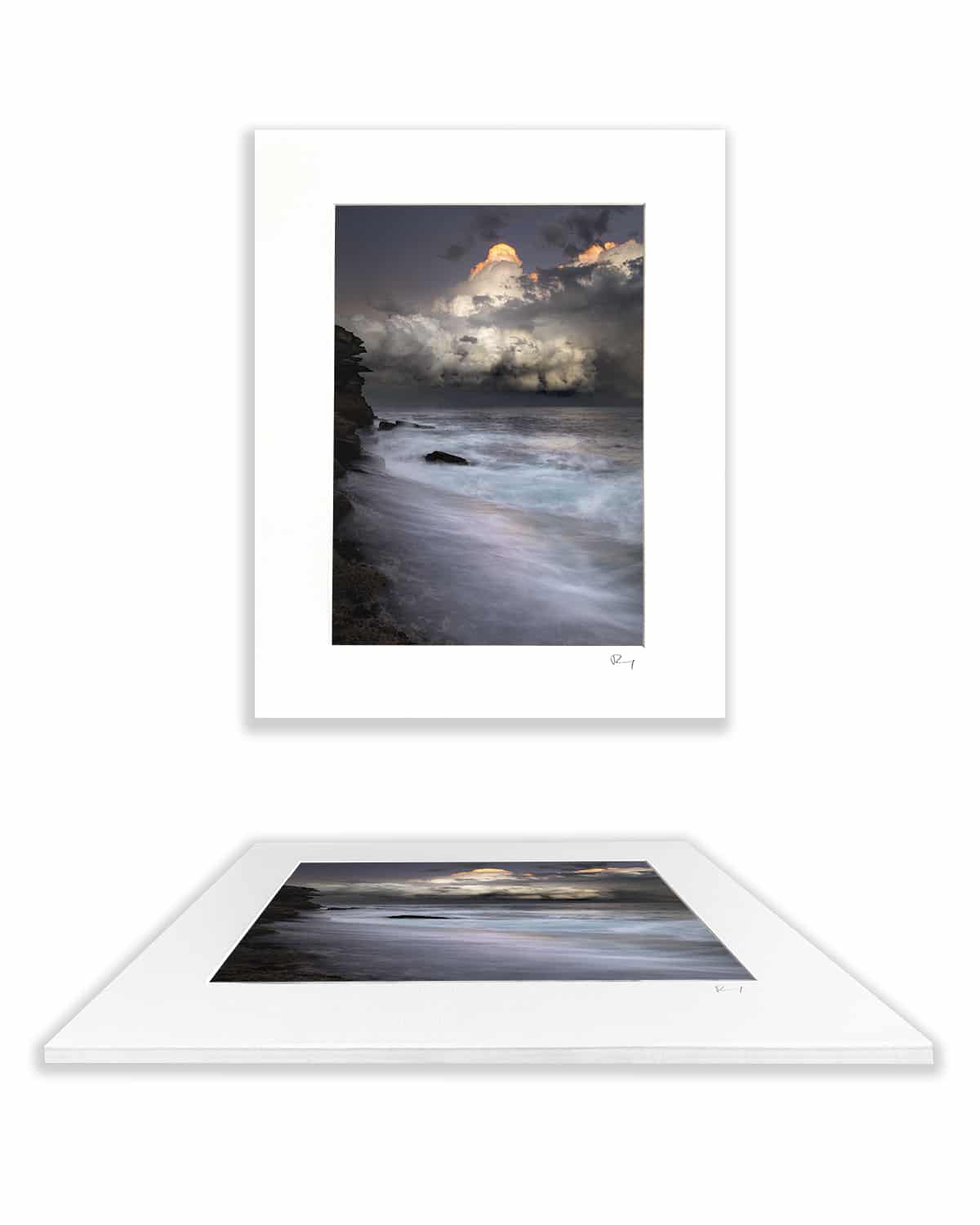 Mounted fine art print of storm clouds above the ocean at Tamarama Beach, Sydney, Australia, presented with a white mat board.